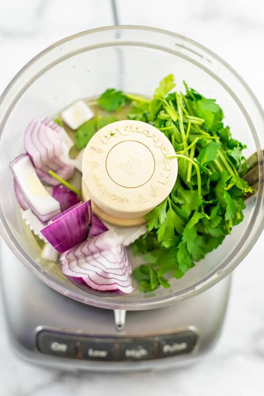 Red onion and parsley in food processor.