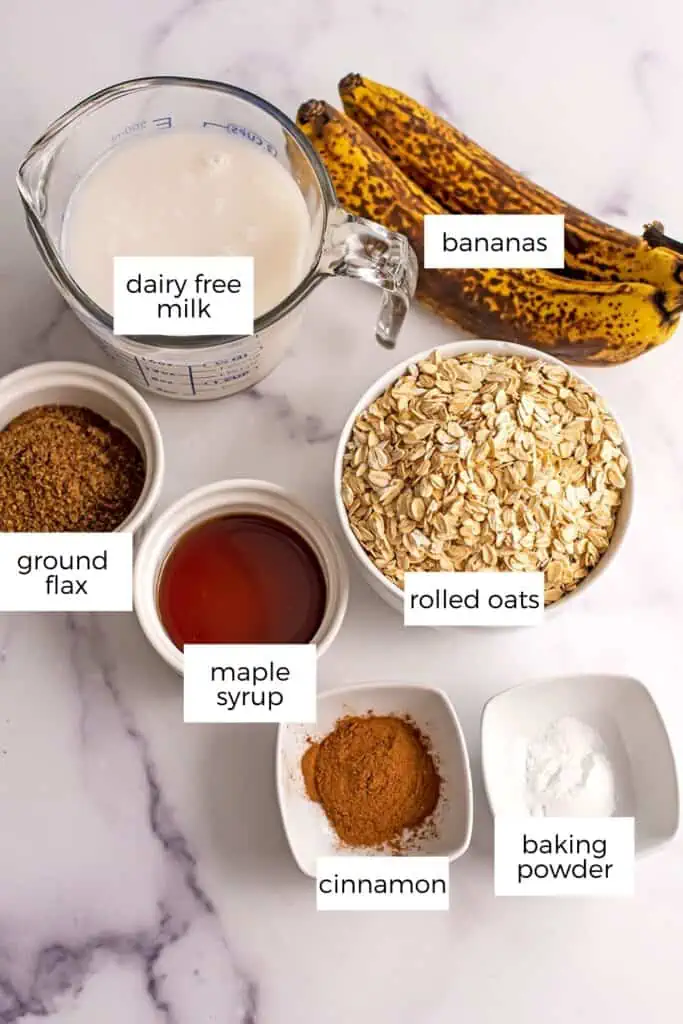 Ingredients for banana bread baked oats on a marble countertop.