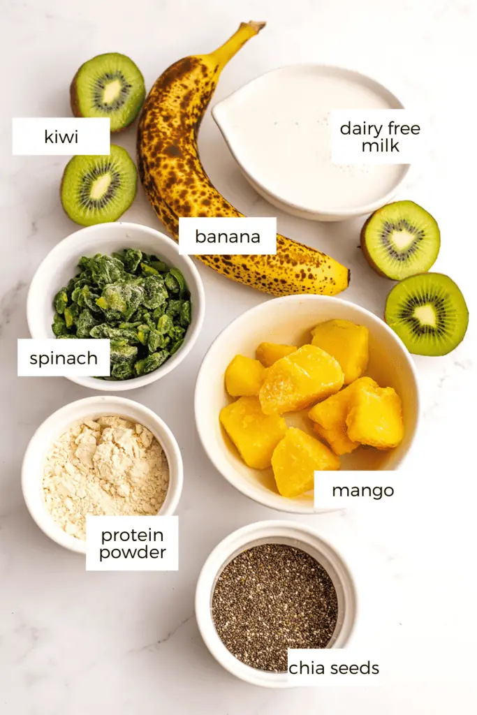 Banana mango kiwi smoothie ingredients in white ramekins.