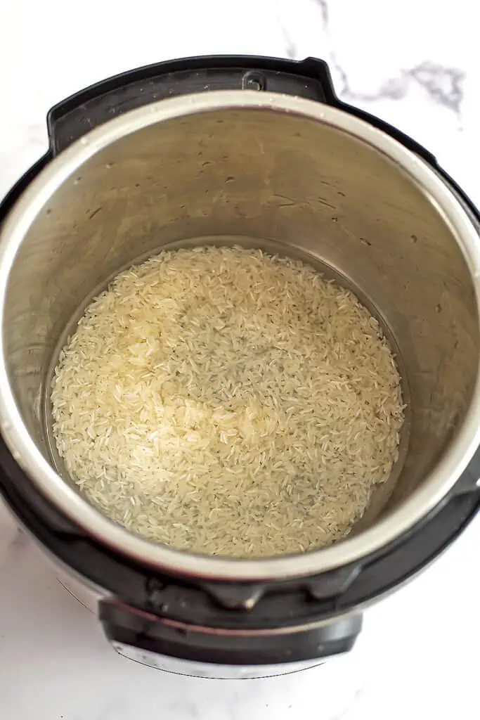 Water and rice in instant pot before cooking.