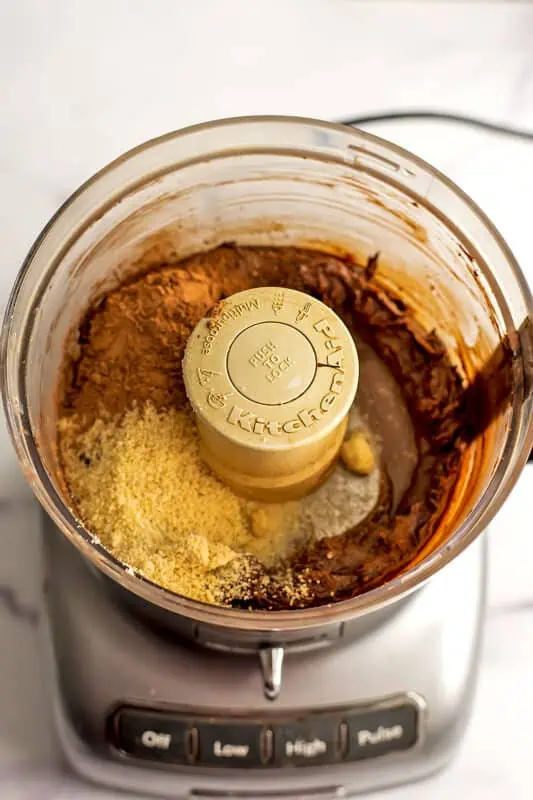 Almond flour and cacao powder in the food processor.