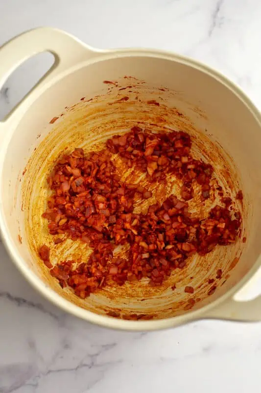 Tomato paste cooked with the onions and garlic.