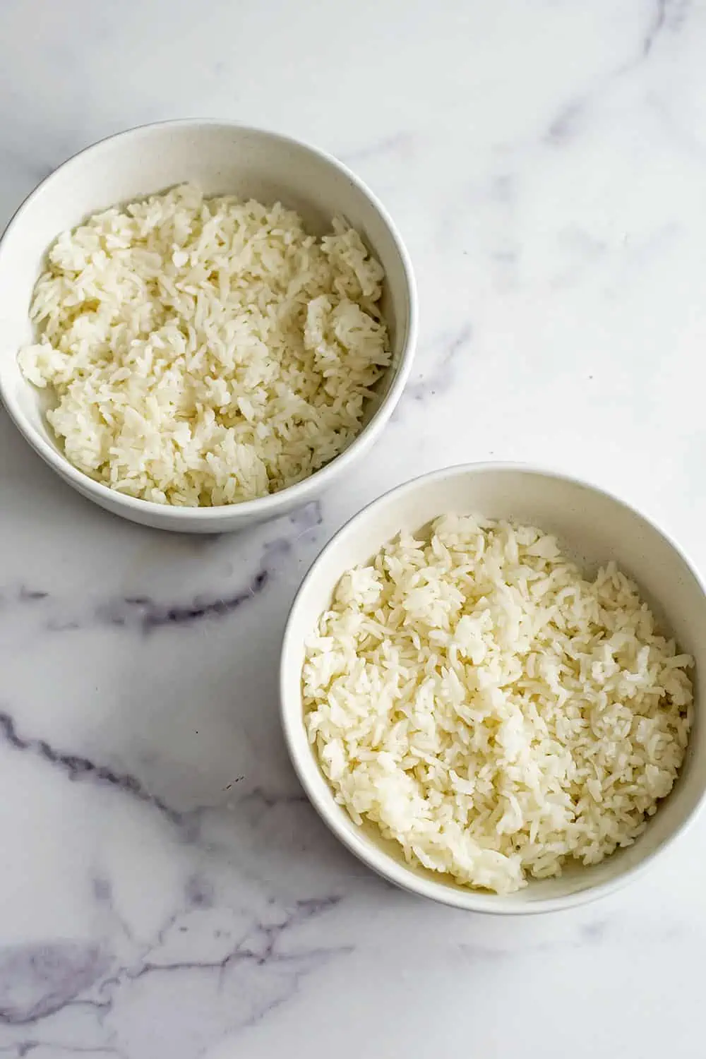 Cooked rice in two bowls.