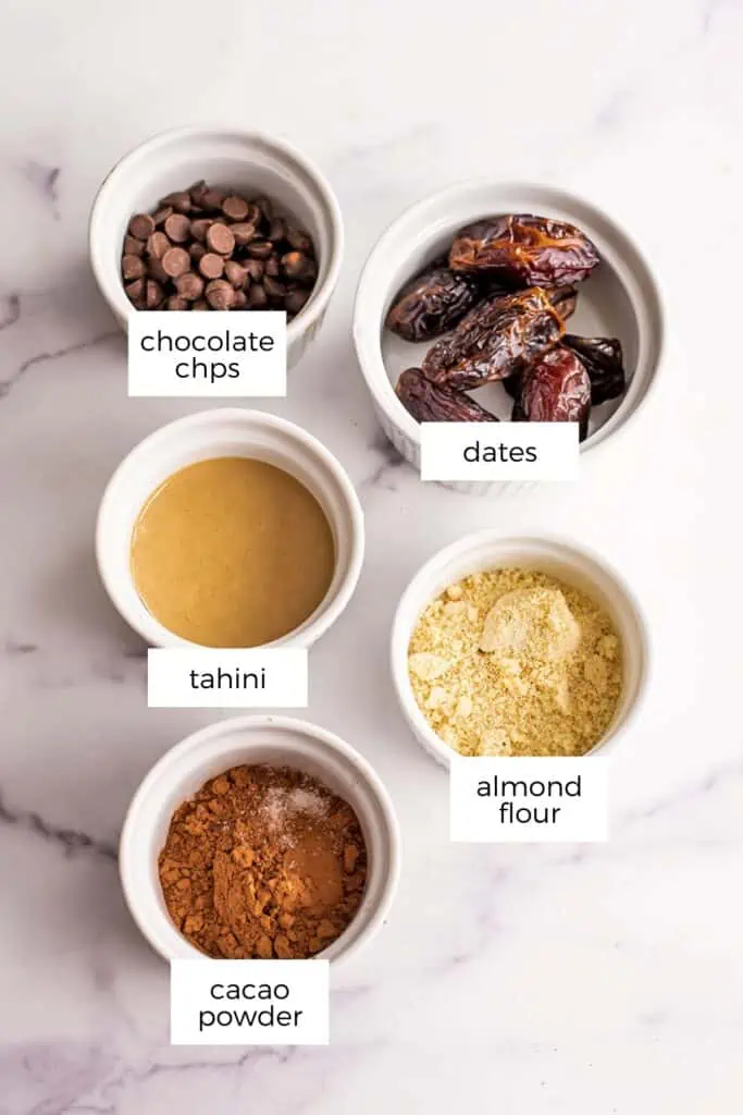 Ingredients to make tahini fudge in white ramekins.