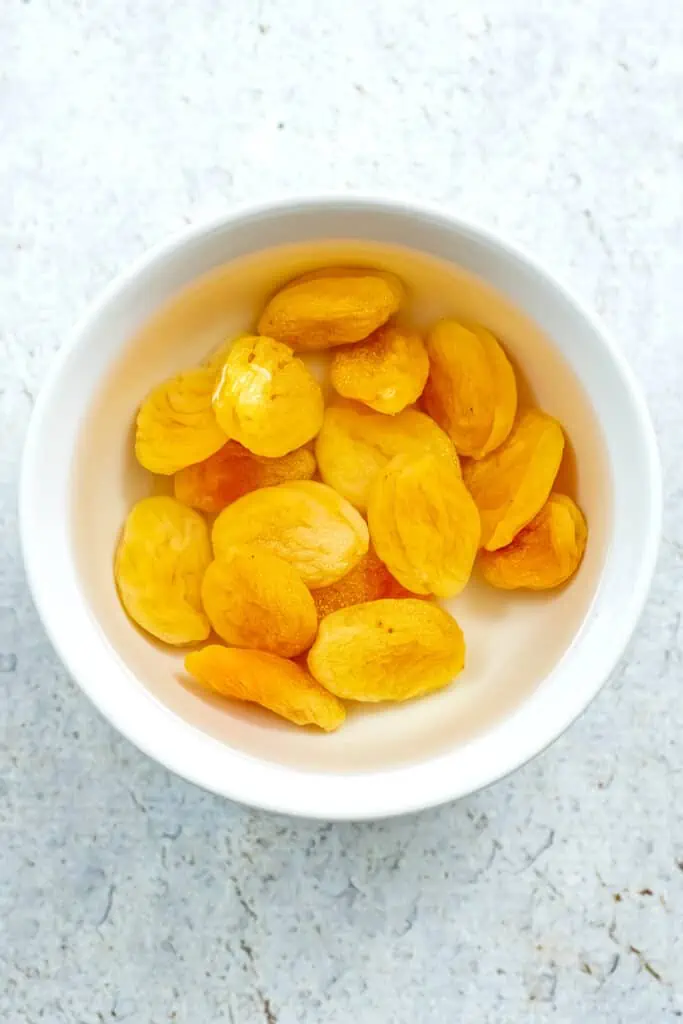 Dried apricots in a bowl after soaking in hot water. 
