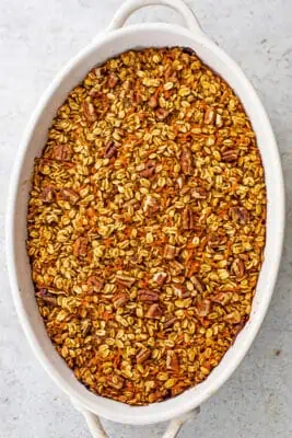 Carrot cake oatmeal bake after baking in oval casserole dish.