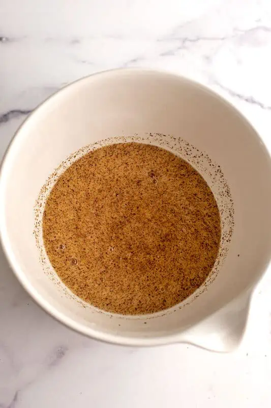 Ground flax, maple syrup and dairy free milk in a large bowl.