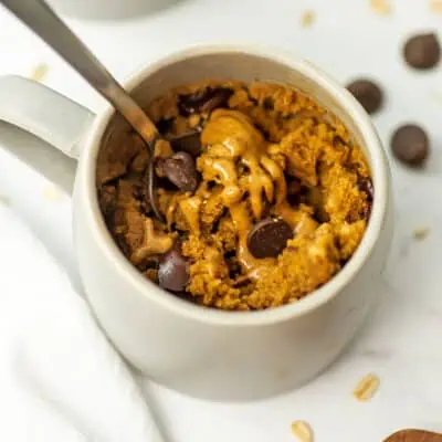 Spoon resting in oat flour mug cake.