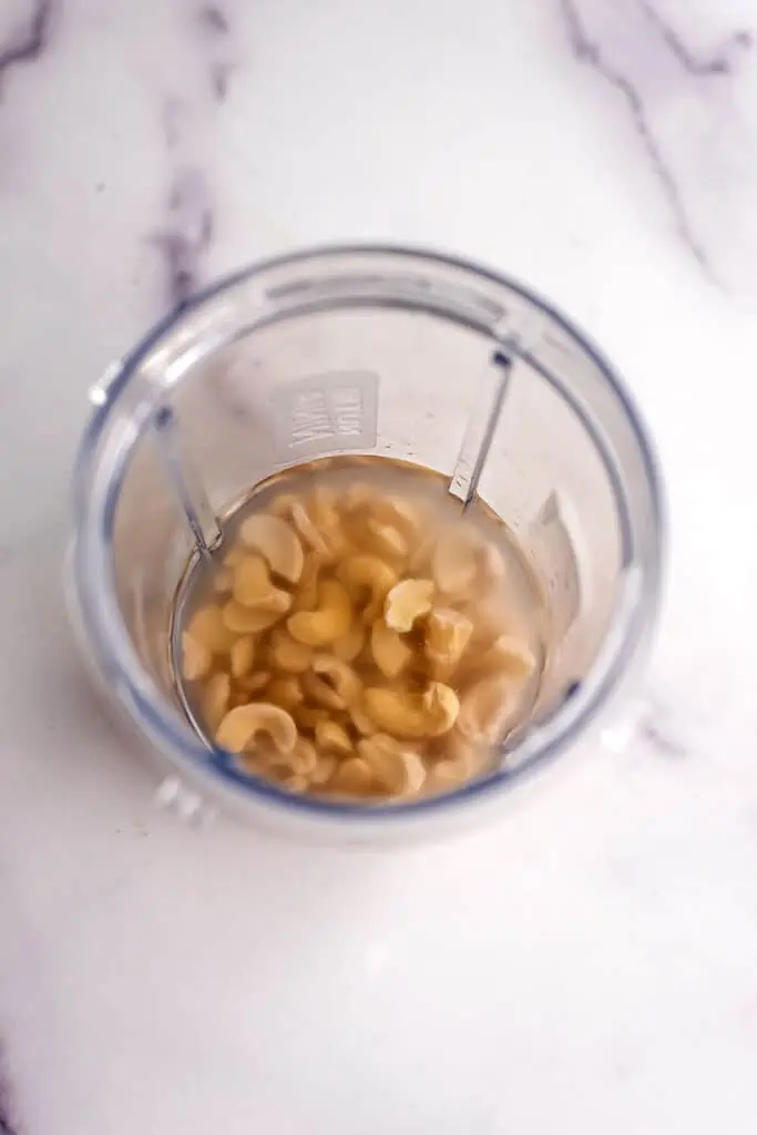 Soaked cashews and water in high speed blender.