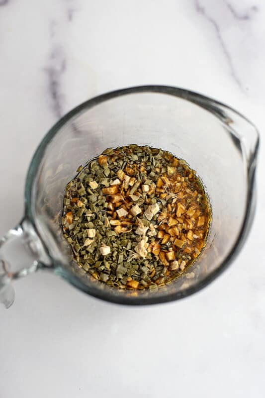 Ingredients to make teriyaki sauce in a glass measuring cup.