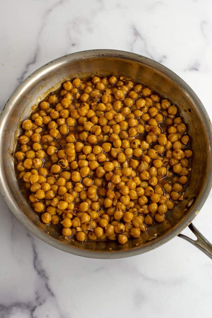 Skillet filled with teriyaki chickpeas after cooking.