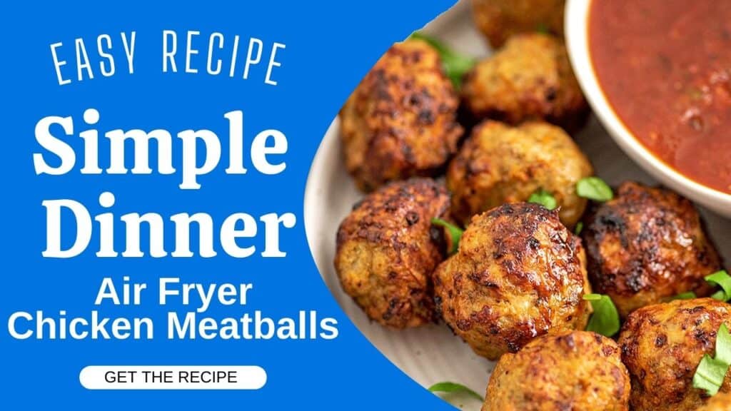 Air fryer chicken meatballs on a plate with marinara sauce.