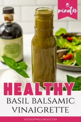 Glass bottle filled with basil balsamic vinaigrette.