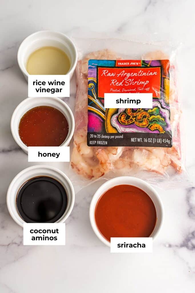 Ingredients to make spicy honey shrimp in ramekins.