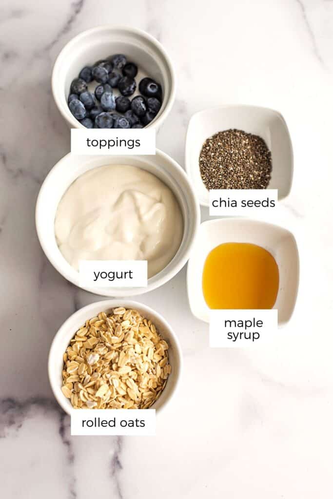 Ingredients to make overnight oats with yogurt (no milk) in ramekins.