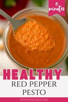 Large glass jar of roasted red pepper pesto.