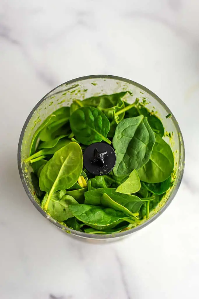 fresh baby spinach in food processor.