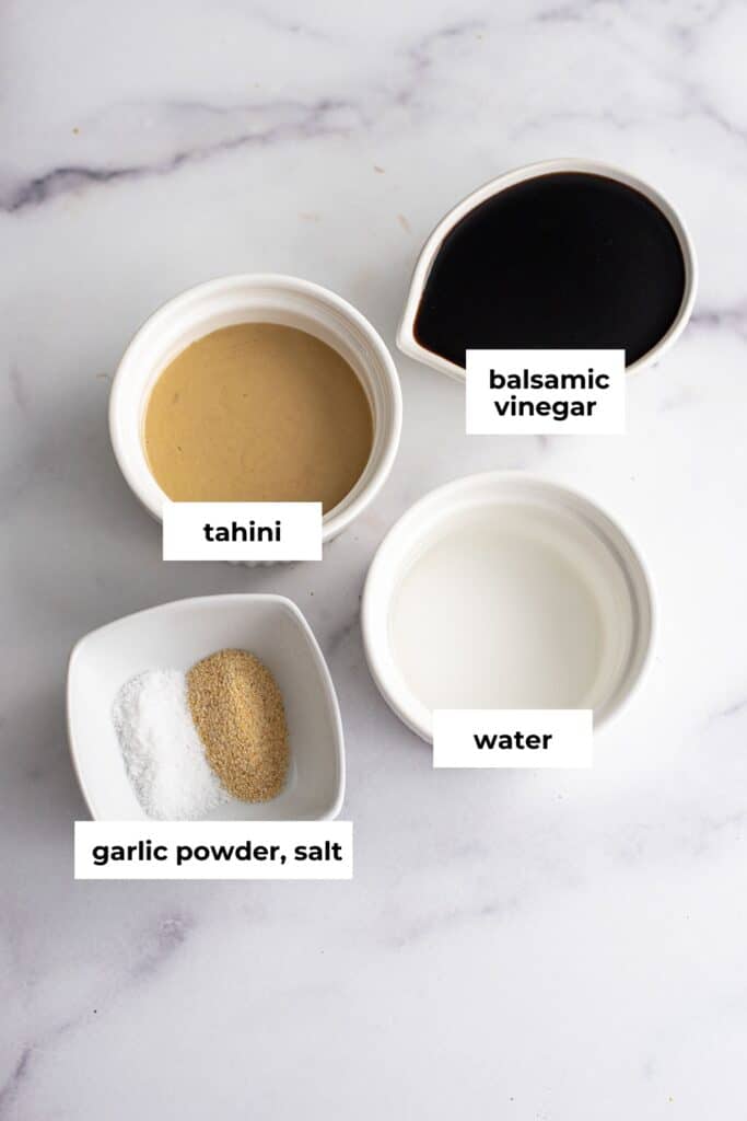 Ingredients to make balsamic tahini dressing in ramekins.