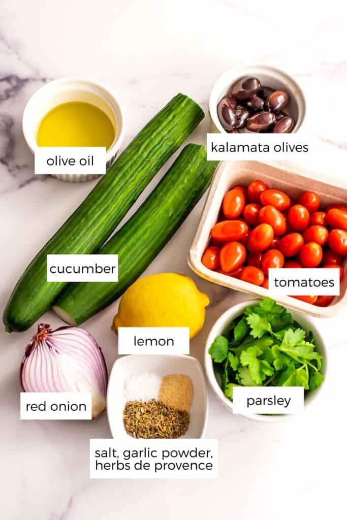 Ingredients to make Mediterranean cucumber tomato salad.