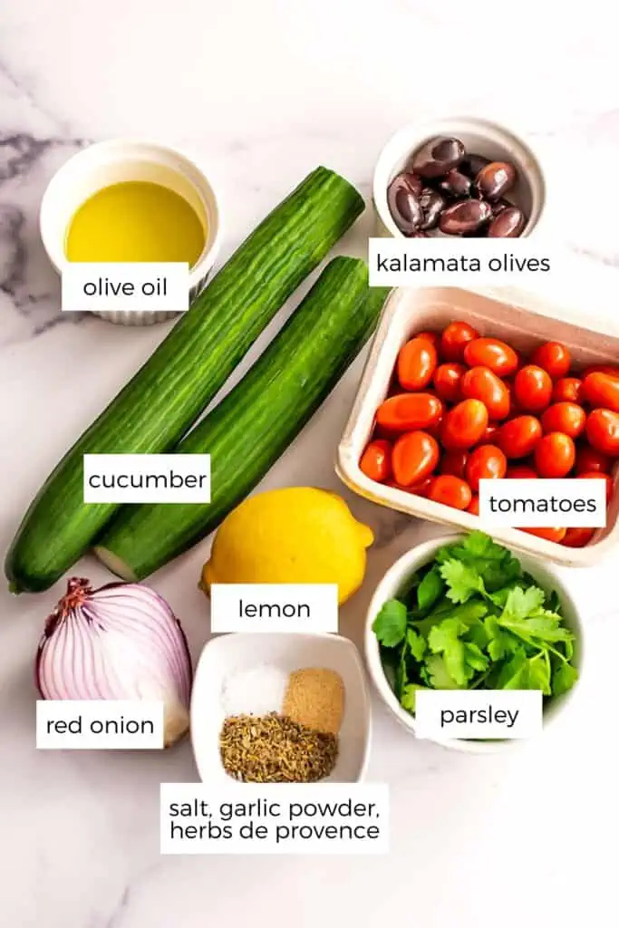 Ingredients to make Mediterranean cucumber tomato salad.