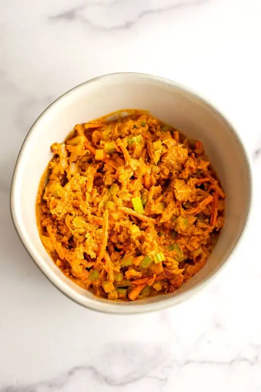 Buffalo tuna salad in a large white bowl.