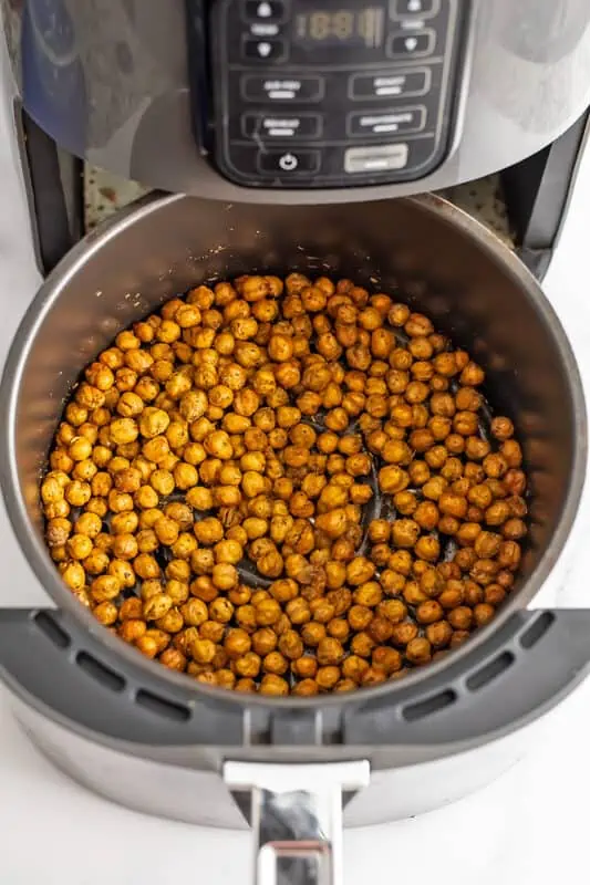 Air fryer roasted chickpeas in an air fryer basket.