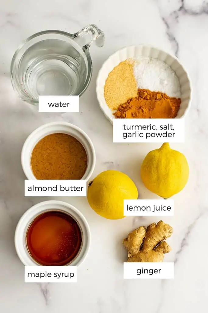 Almond butter turmeric dressing ingredients in white ramekins,