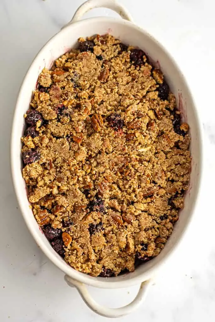 Gluten free blackberry crumble fresh out of the oven in a casserole dish.