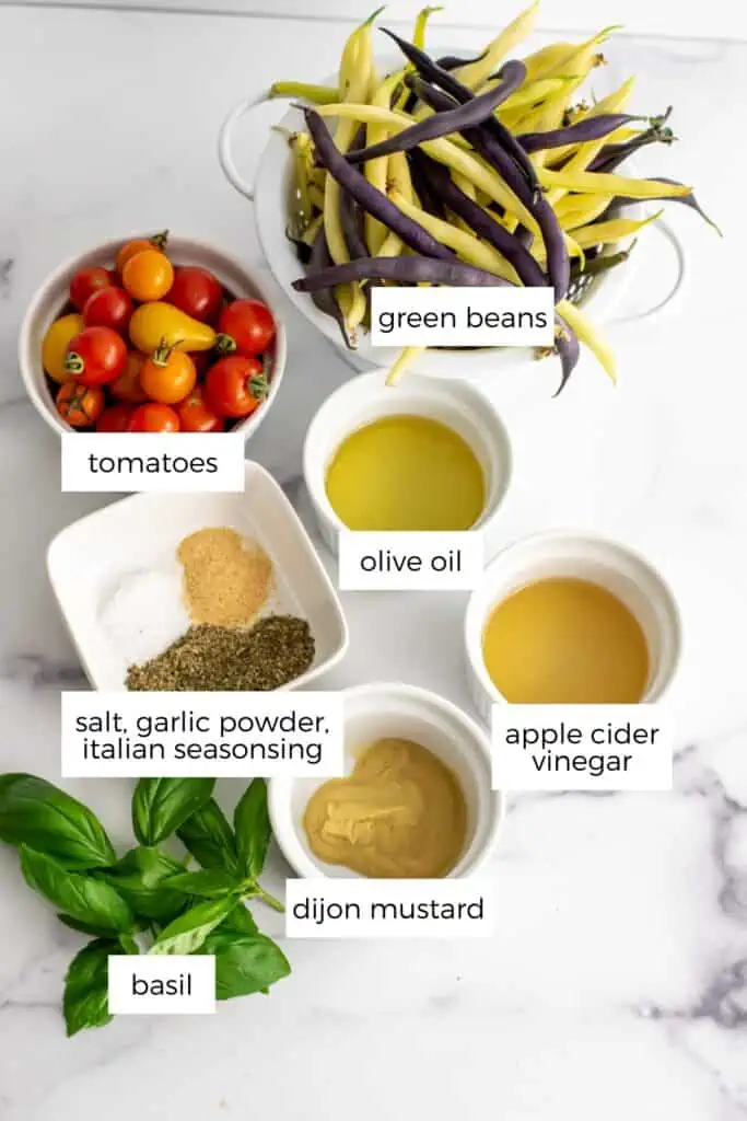 Italian green bean salad ingredients in white ramekins.