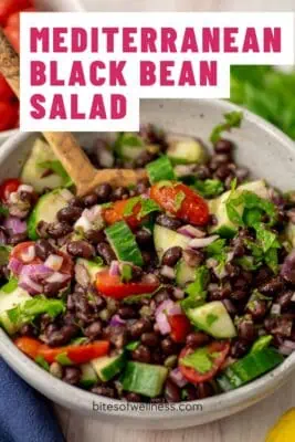 Large bowl of black bean cucumber tomato salad.