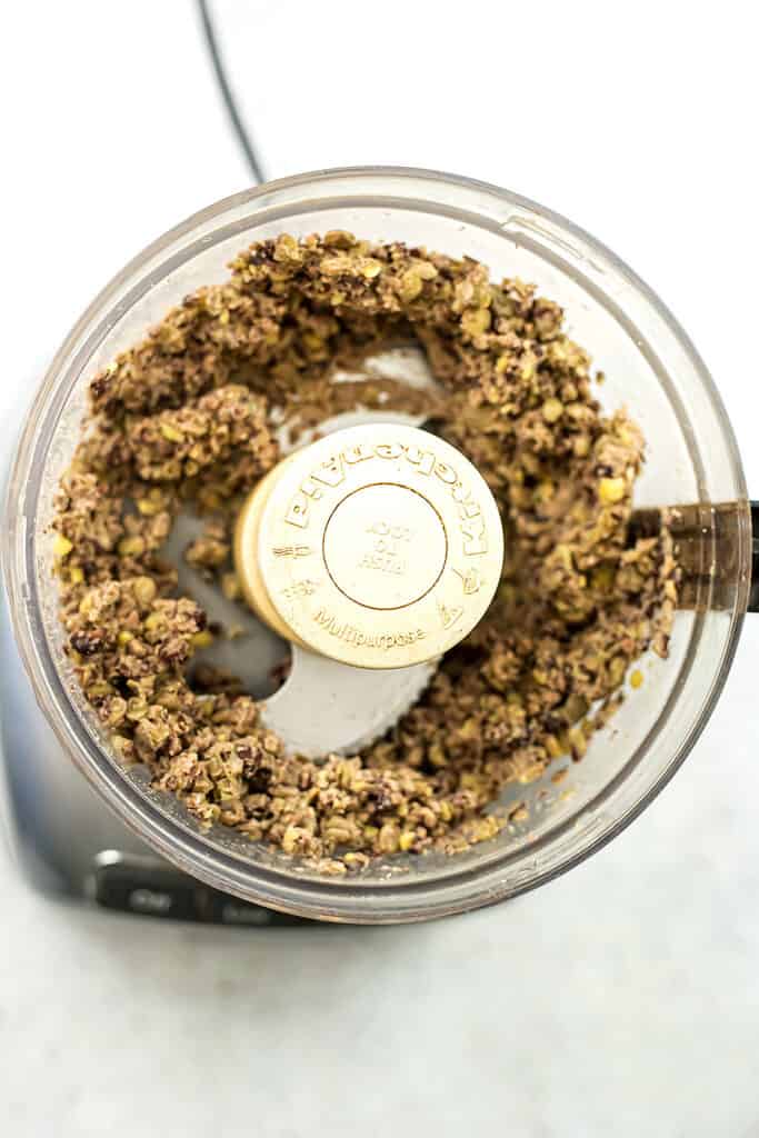Black bean and lentil mixture in food processor after blending.