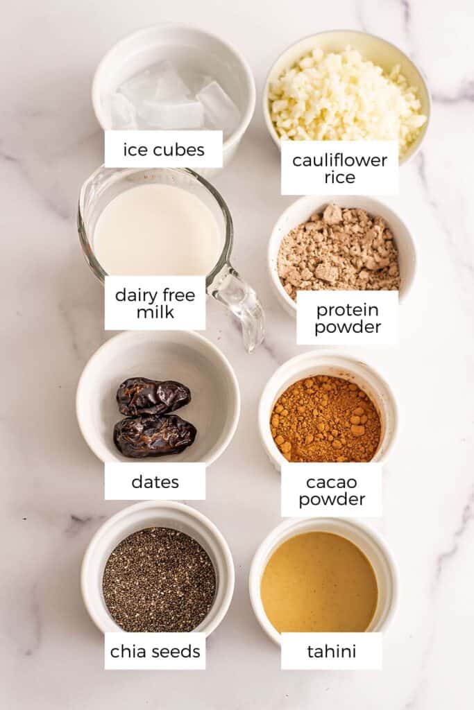 Chocolate tahini smoothie no banana ingredients in white ramekins. 