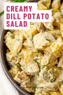 Large bowl filled with creamy dill potato salad.