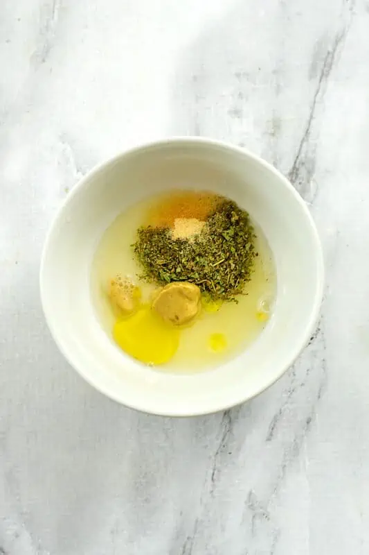 Lemon dressing ingredients in a bowl.