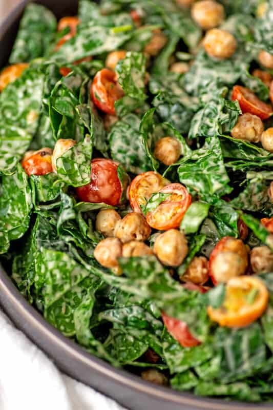 Kale chickpea salad after tossing with tahini dressing.