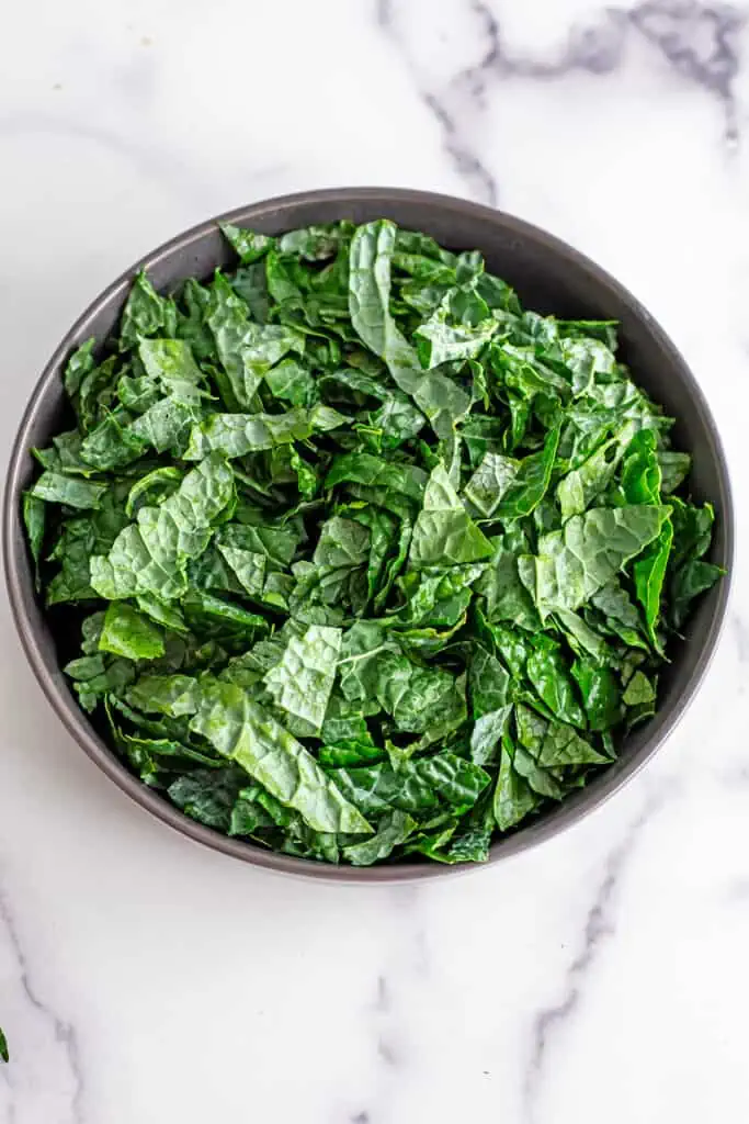 Chopped kale in a gray bowl.