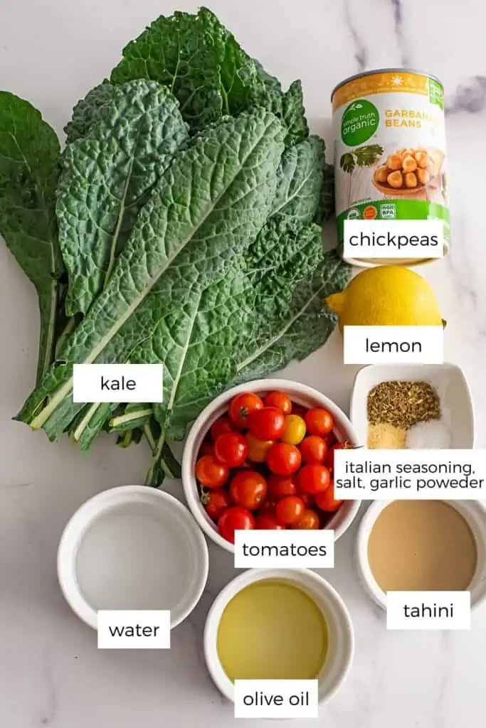 Kale tahini salad ingredients in white ramekins.
