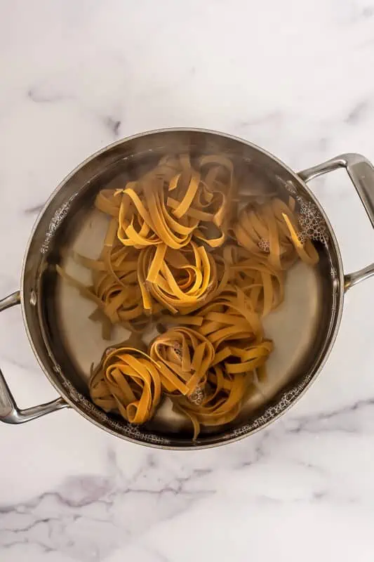 Pasta cooking in a large pot.