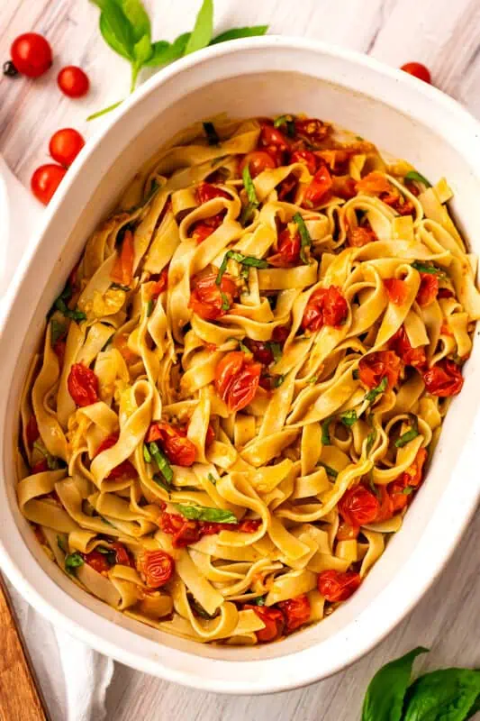 Cherry tomato pasta sauce in a large casserole dish.