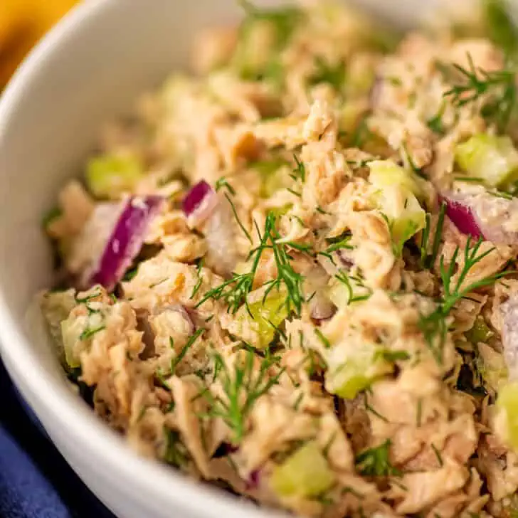 Dill tuna salad in a white bowl.