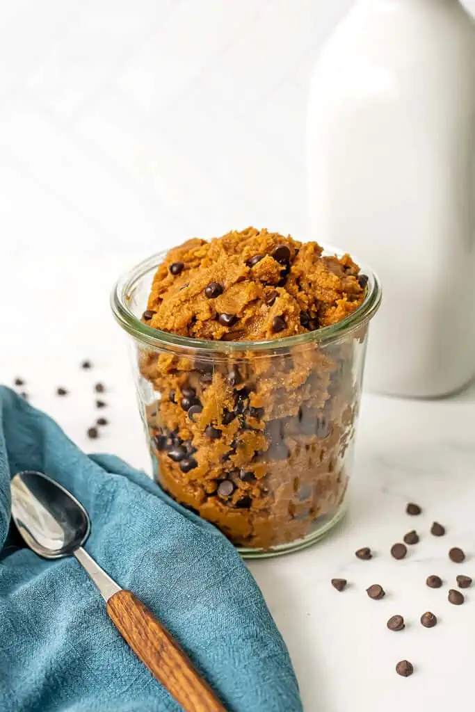 Protein cookie dough in a glass jar.