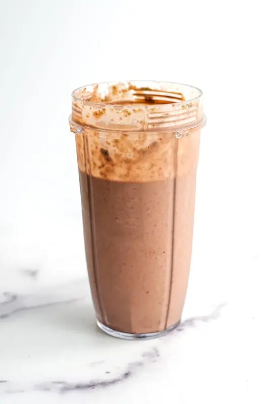 Cherry kale smoothie in a blender cup after being blended.