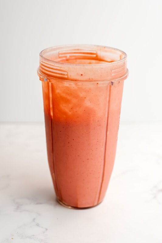 Strawberry mango banana smoothie after being blended.