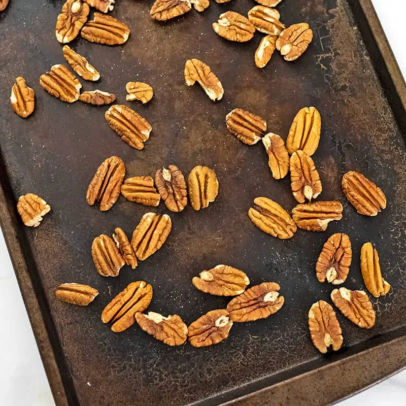 Pecans on baking sheet.