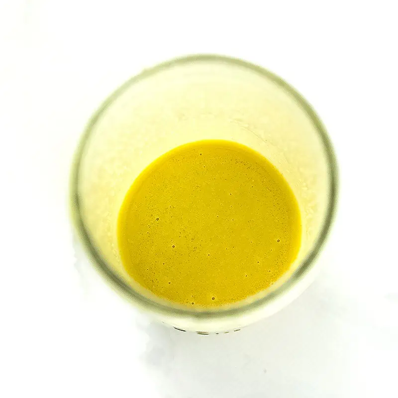 Lemon vinaigrette in a jar after shaking.