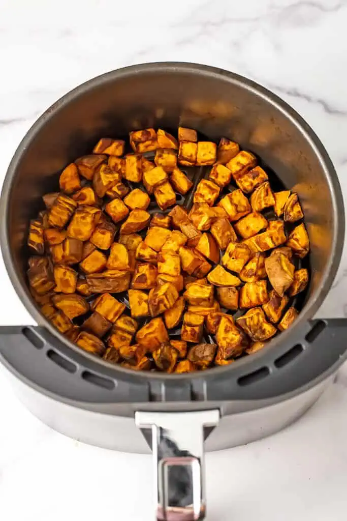 Sweet potato cubes for salad after roasting in air fryer.