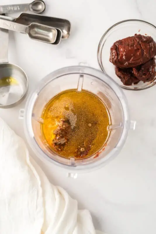 Ingredients to make honey chipotle sauce in blender.