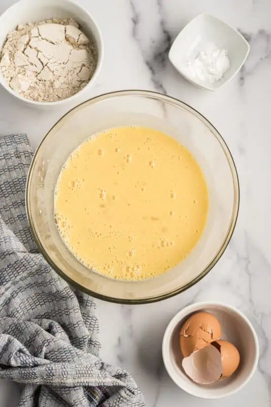 Liquid ingredients blended in a glass bowl.
