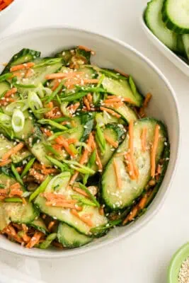 Carrot and cucumber salad with sesame Asian dressing.