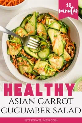 Large bowl filled with asian cucumber carrot salad.